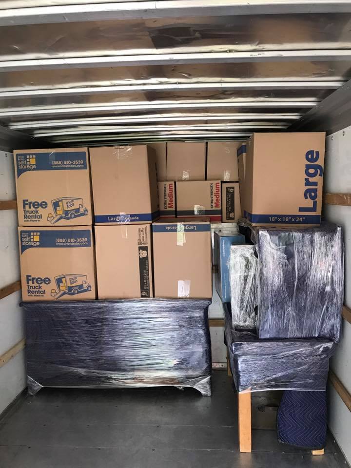 Fully loaded box truck packed to the roof