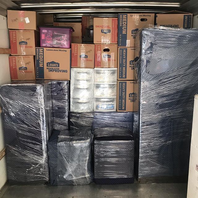 Coyne's crew moving a large piece of furniture