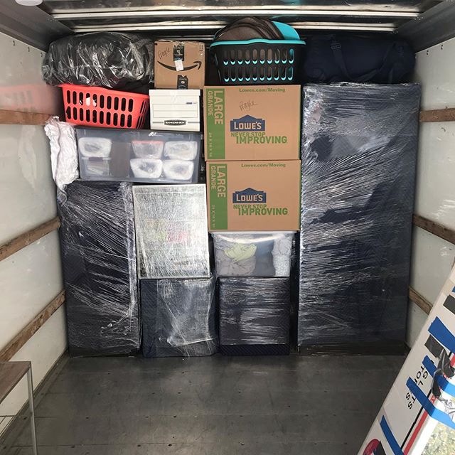 Furniture being loaded into the moving truck